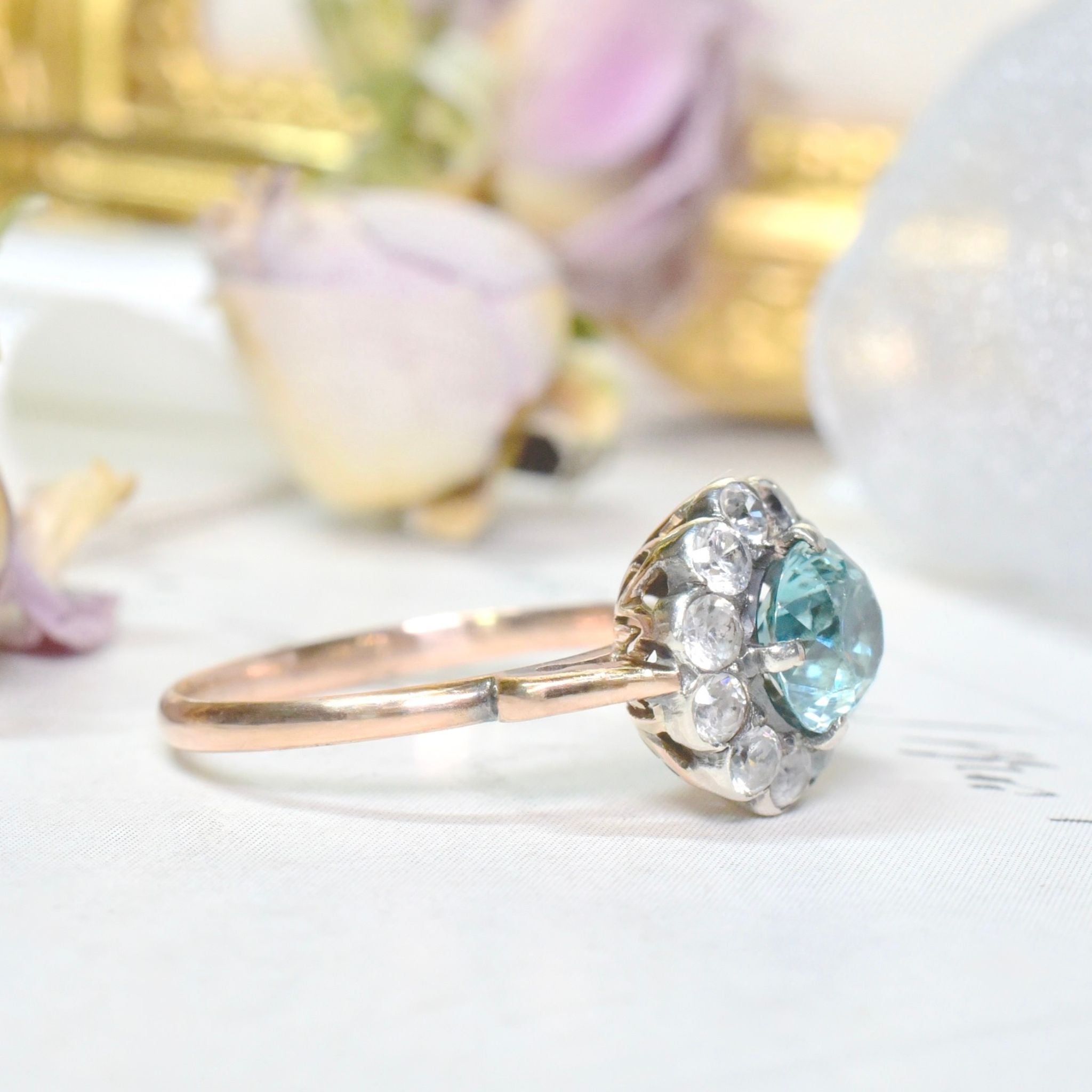 Art Deco Era 9ct Rose Gold Blue Zircon And White Spinel ‘Daisy Halo’ Ring