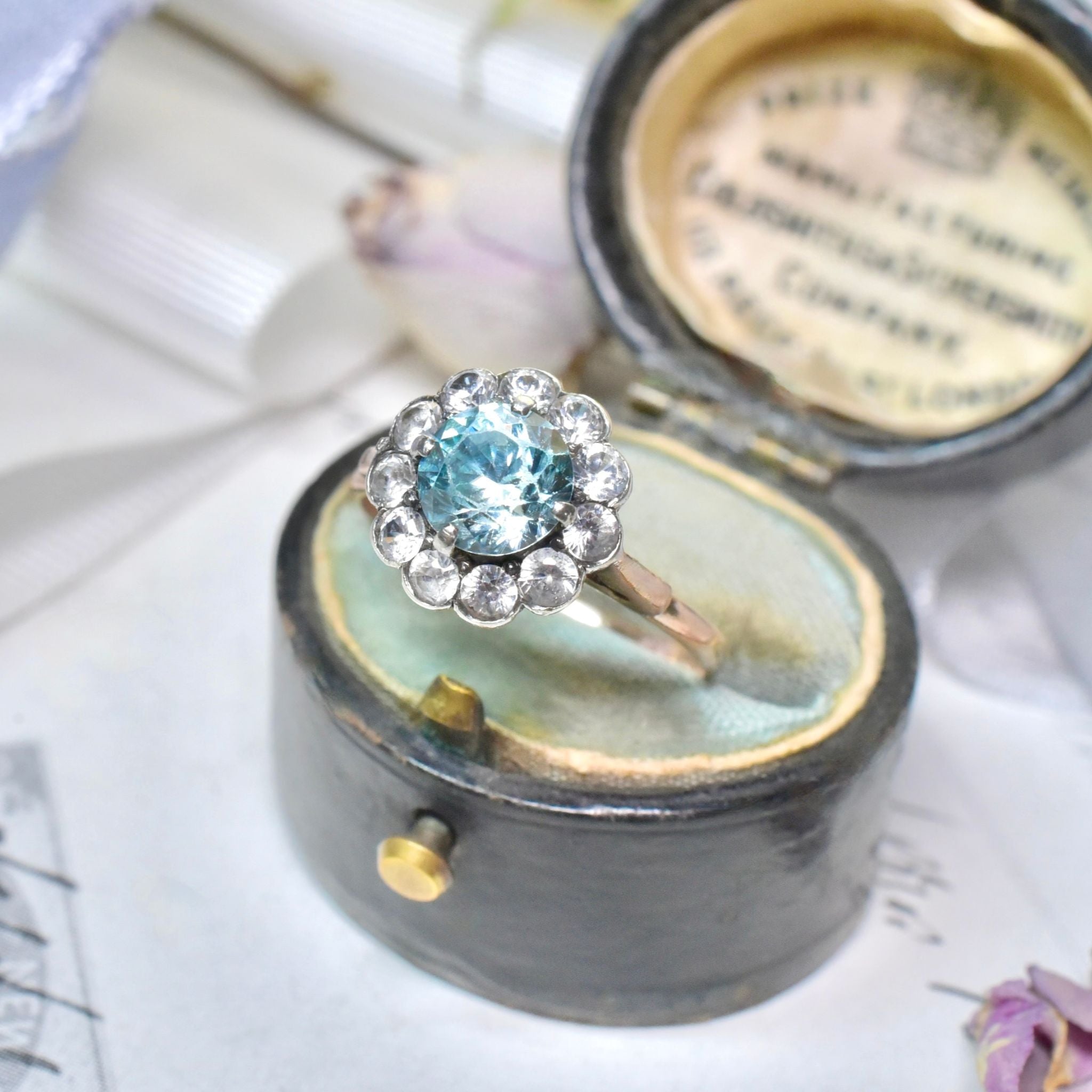 Art Deco Era 9ct Rose Gold Blue Zircon And White Spinel ‘Daisy Halo’ Ring