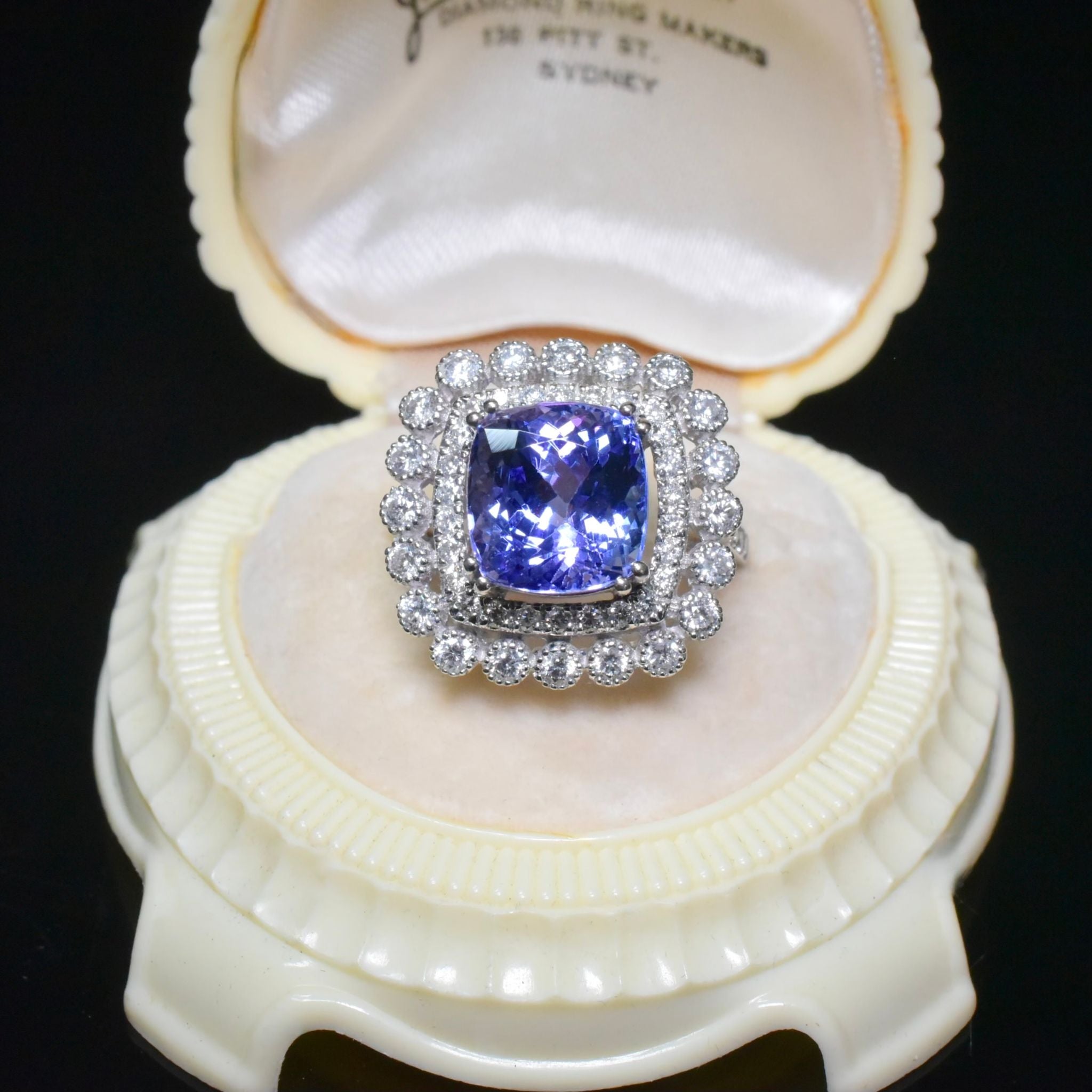Modern 18ct White Gold Tanzanite And Diamond Halo Ring