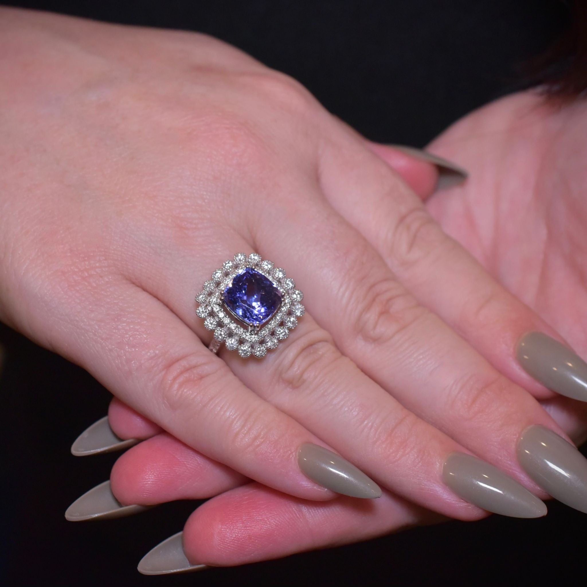 Modern 18ct White Gold Tanzanite And Diamond Halo Ring