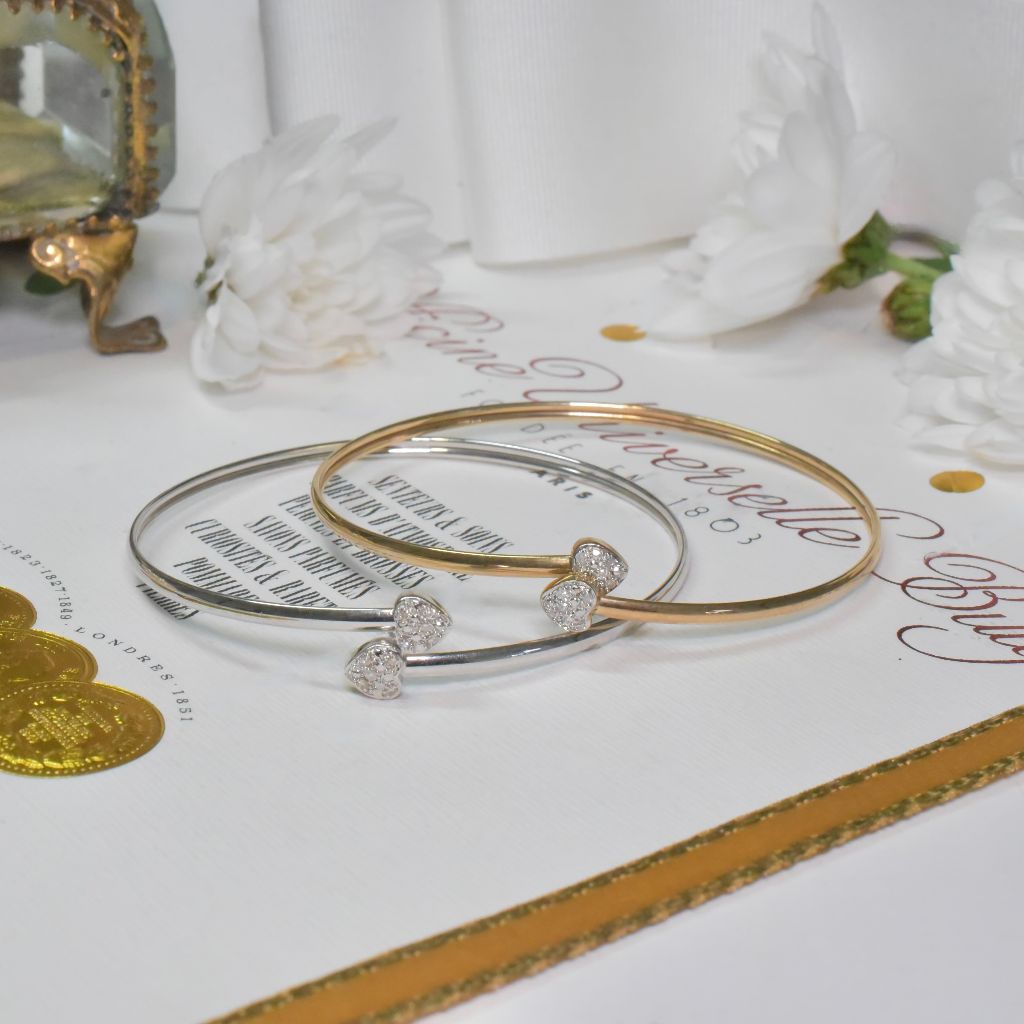 Modern Pair Of 9ct Yellow, And 9ct White Gold And Diamond Heart Bangles