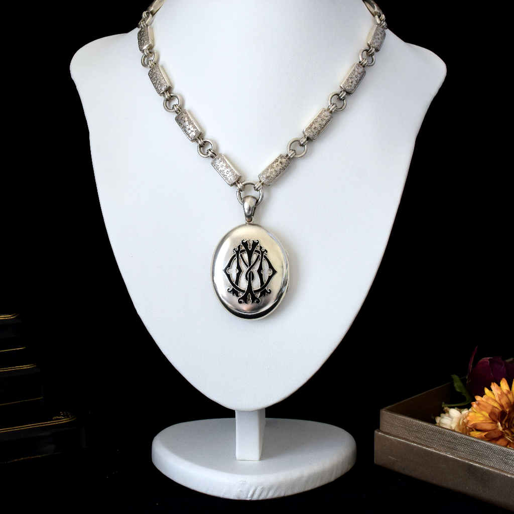 Antique Victorian Sterling Silver ‘In Memory Of’ Enamel Locket and Floral Engraved Bookchain Circa 1890