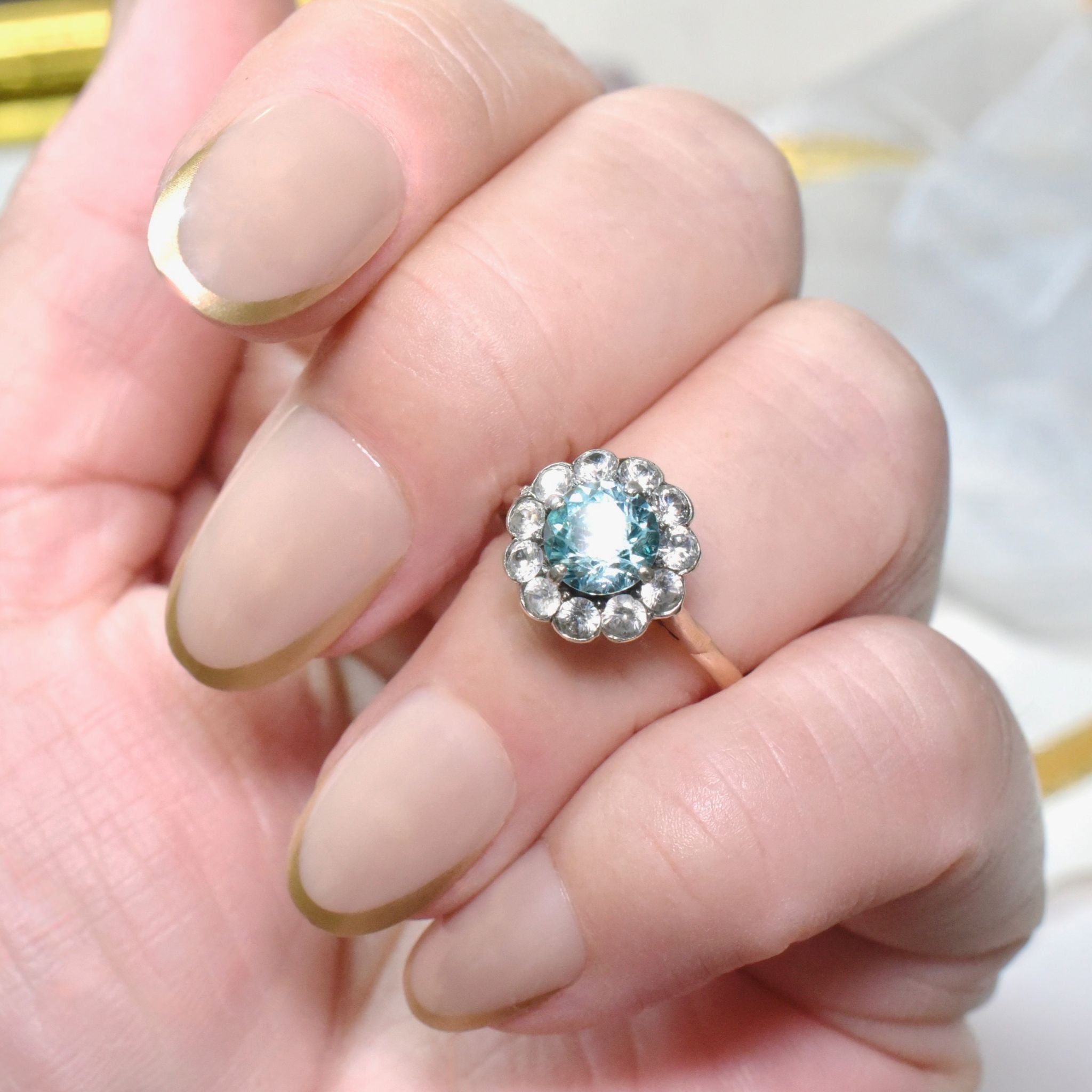 Art Deco Era 9ct Rose Gold Blue Zircon And White Spinel ‘Daisy Halo’ Ring