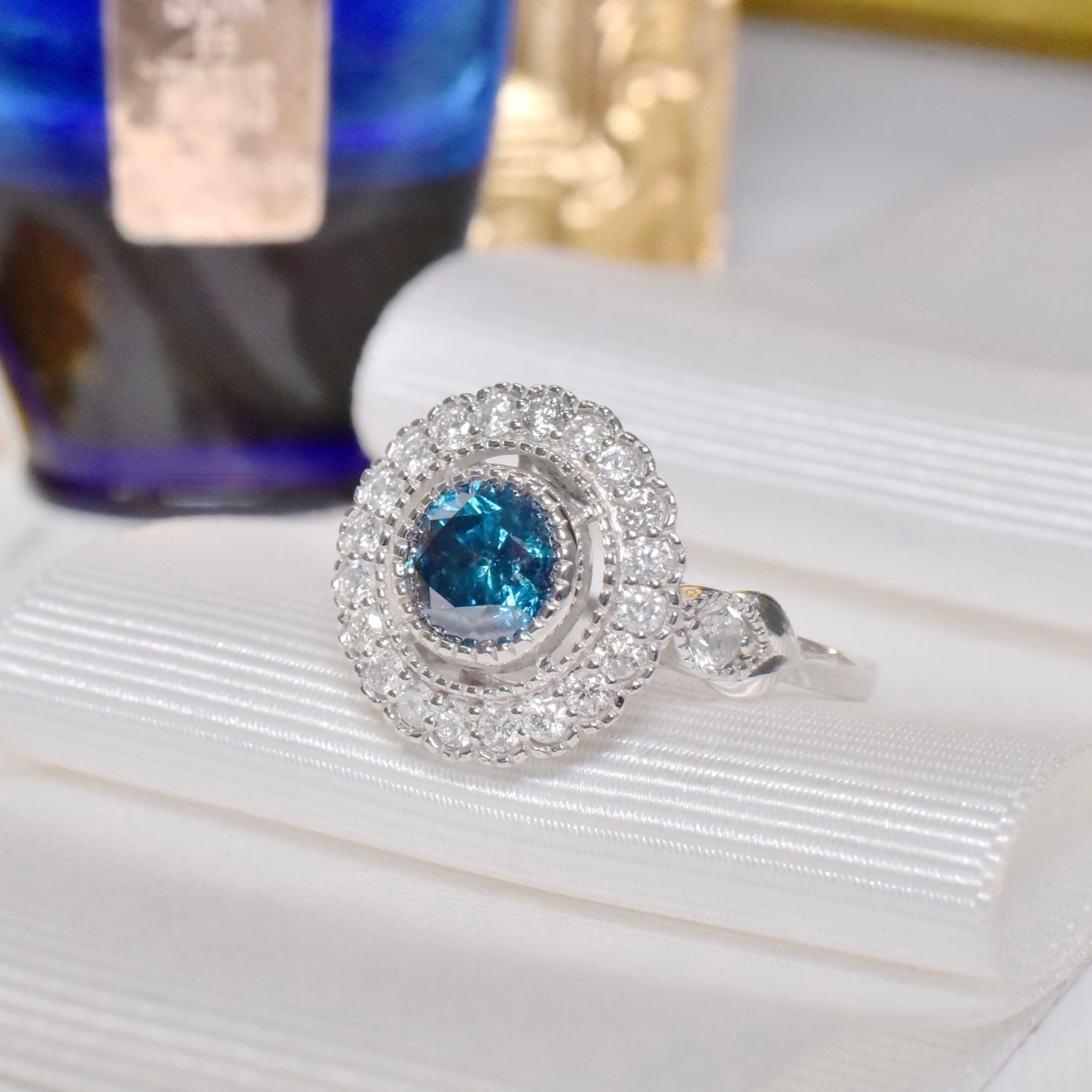 Exquisite 18ct White Gold ‘0.95ct Blue Diamond’ And White Diamond (0.48ct) Halo Ring -  Included In Purchase Valuation For $18,600 AUD