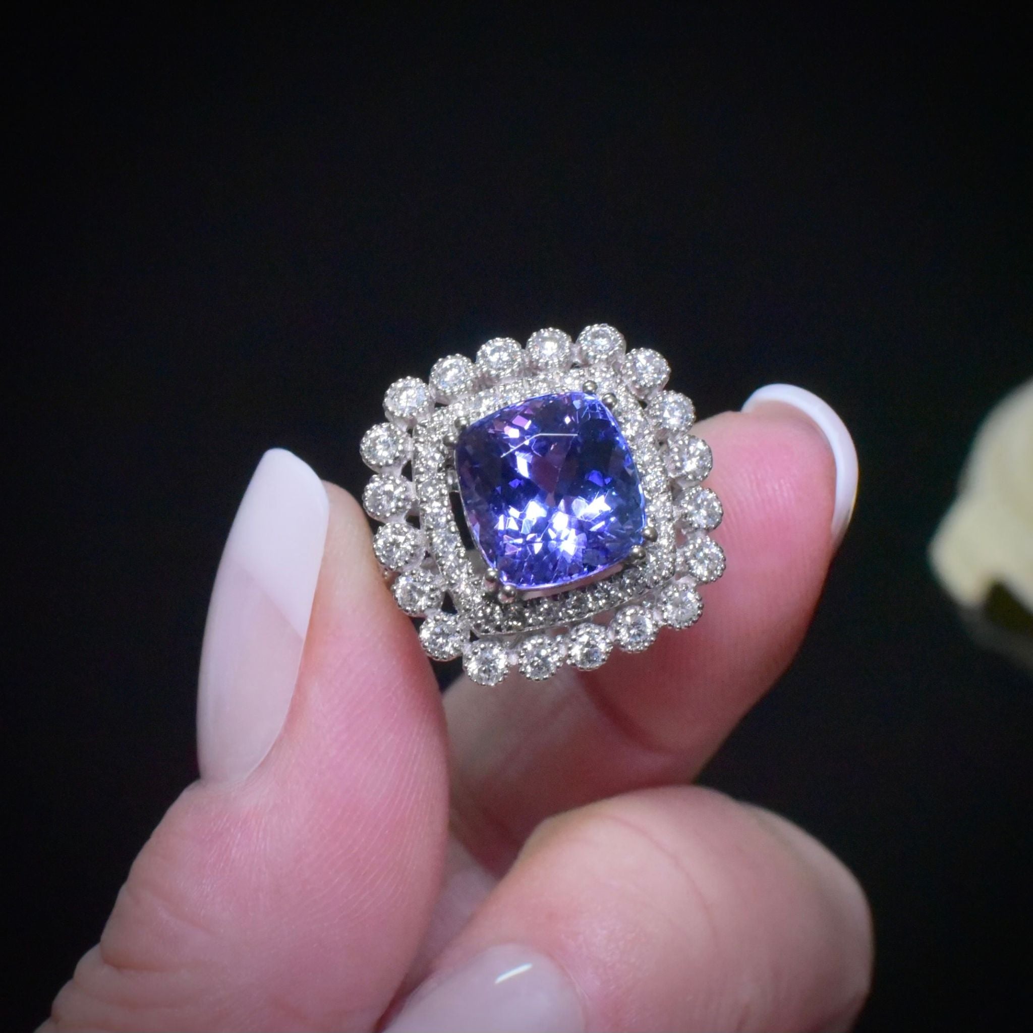Modern 18ct White Gold Tanzanite And Diamond Halo Ring