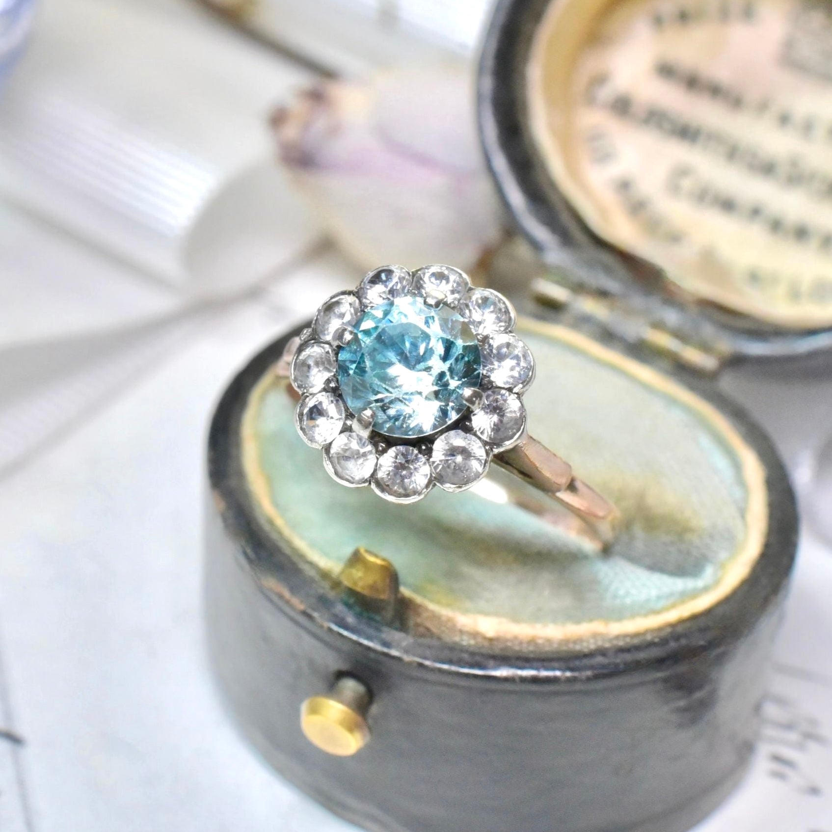 Art Deco Era 9ct Rose Gold Blue Zircon And White Spinel ‘Daisy Halo’ Ring