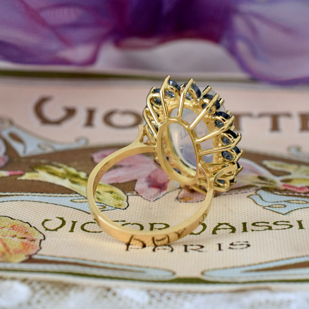 Modern 18ct Yellow Gold Moonstone And Sapphire Ring Independent Insurance/Retail Replacement Valuation Included For $5,250 AUD